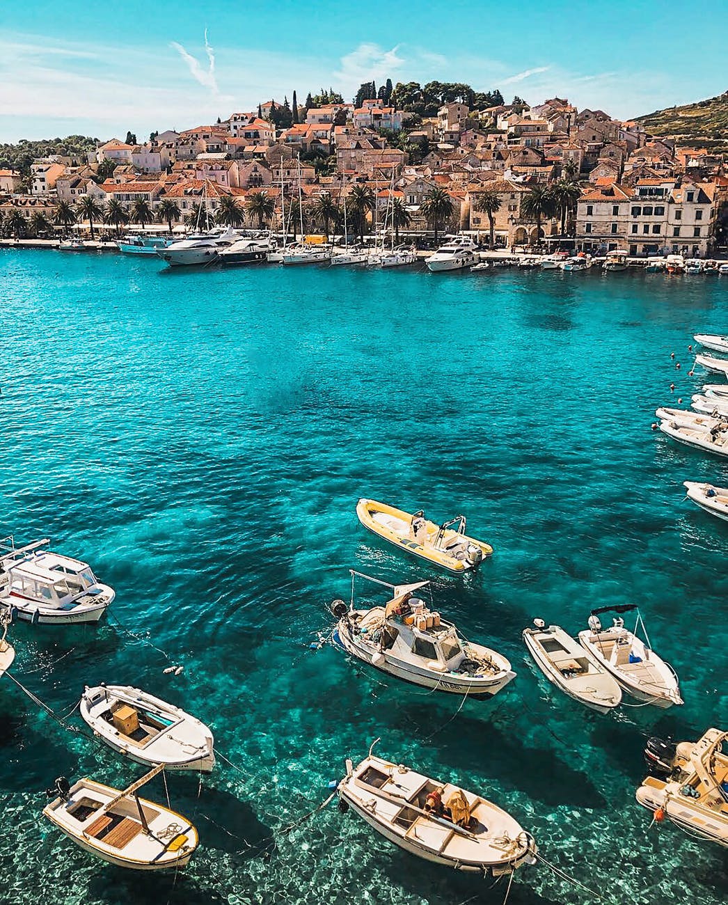 white boats on body of water