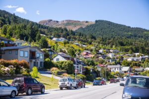 cars parked beside mountains