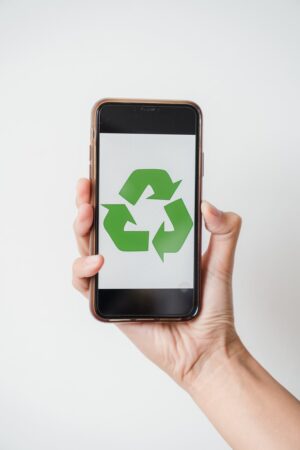 close up shot of a person showing a zero waste signage in a smartphone